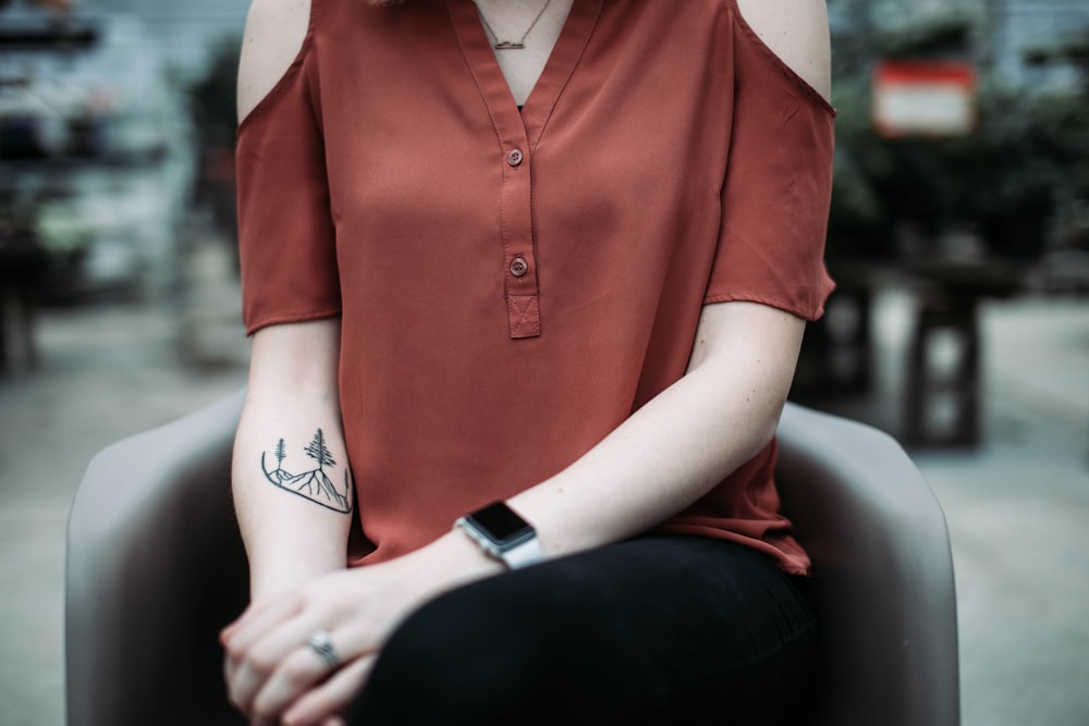 woman wearing brown blouse