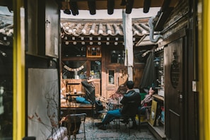 A group enjoying traditional Moroccan tea in a riad courtyard