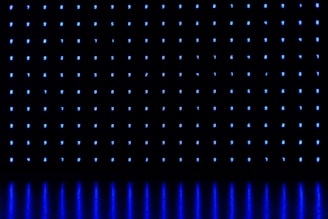 a black background with blue lights on it