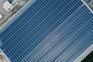 Aerial view of solar panels on a sunny rooftop.
