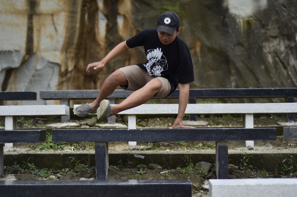 man leaping on table