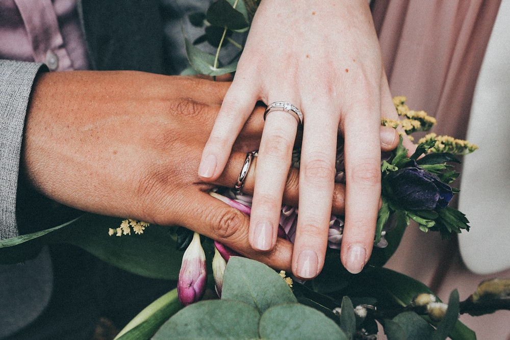 person touching flowers