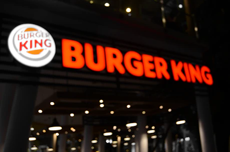 A vibrant Burger King storefront with customers enjoying meals.