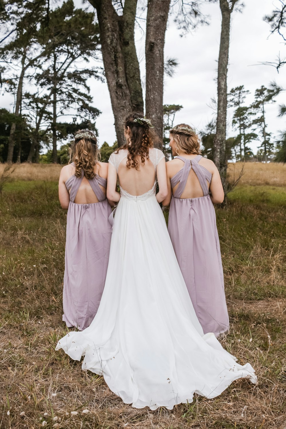 woman wearing backless wedding gown