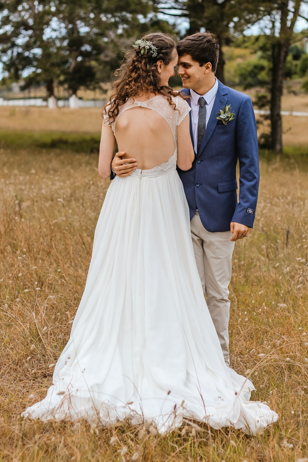 woman wearing backless wedding gown