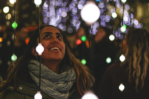 A joyful person receiving a luxuriously arranged cesta, with smiles and warm lighting.
