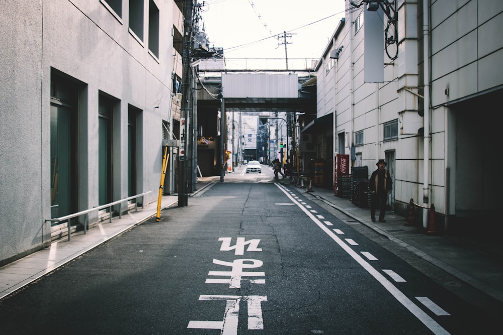 person walking near road during daytime