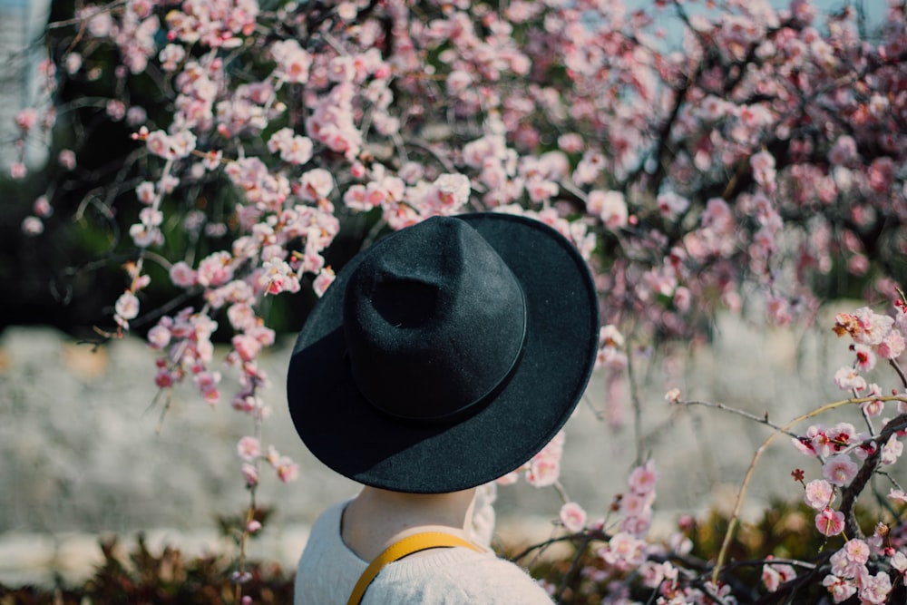 person wearing black hat