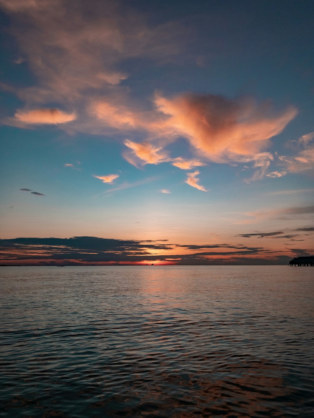 orange clouds over sea