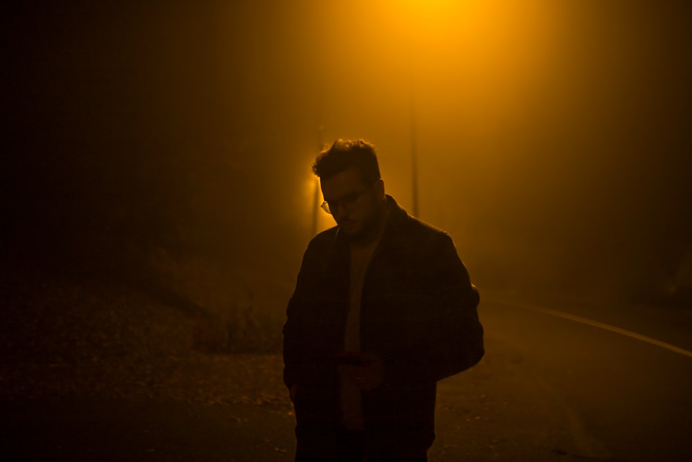 man standing near street