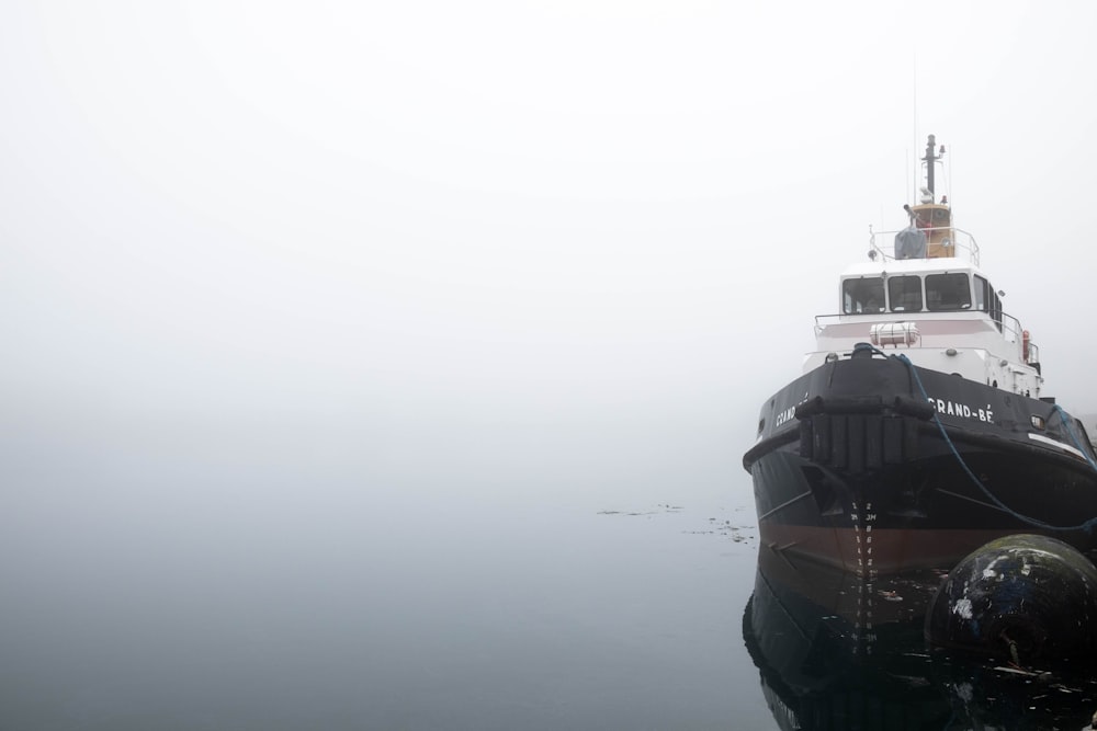 black and white ship on sea