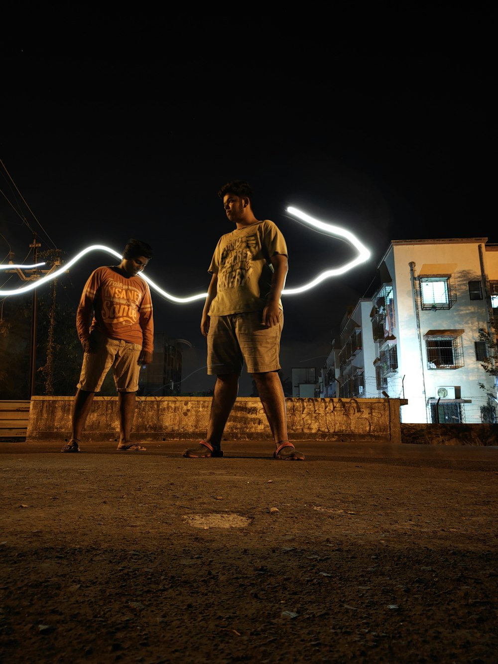 two men standing on brown ground