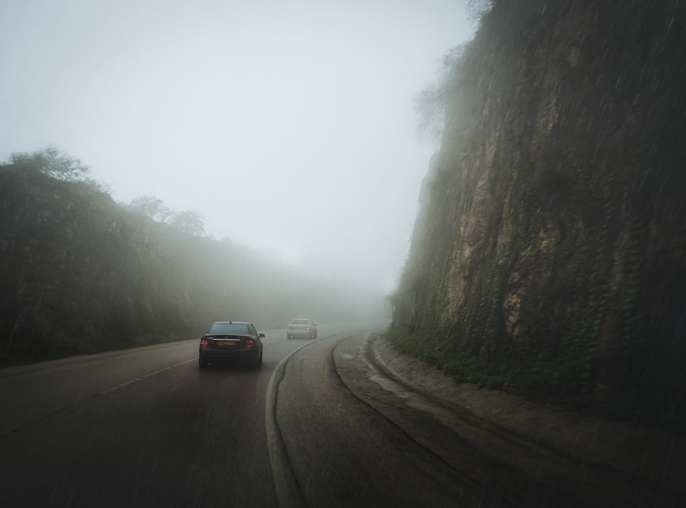 two vehicles travelling on road