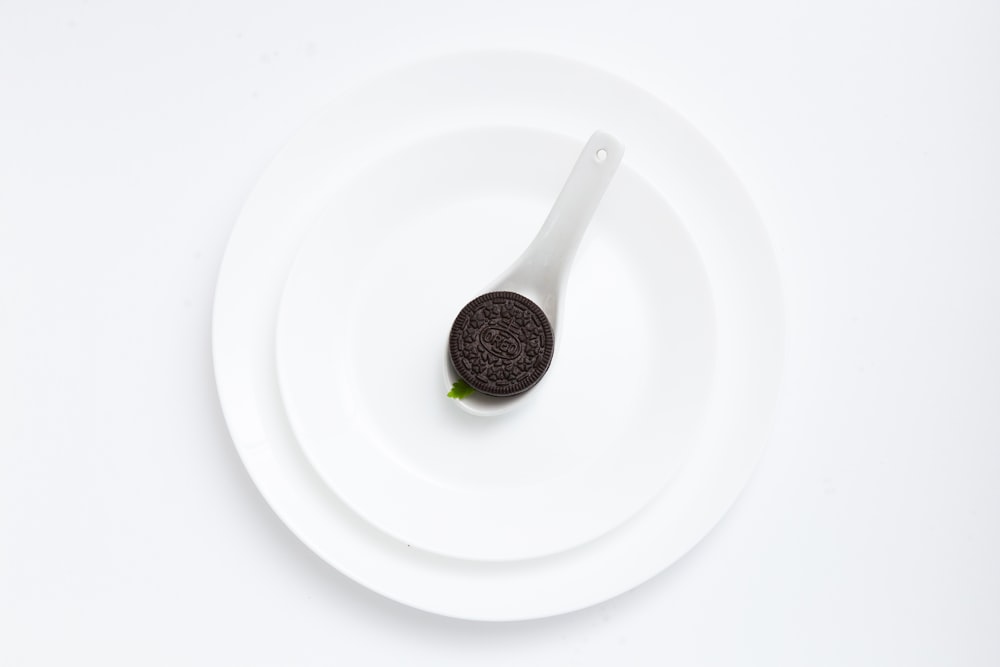 Oreo cookie on plate on white background