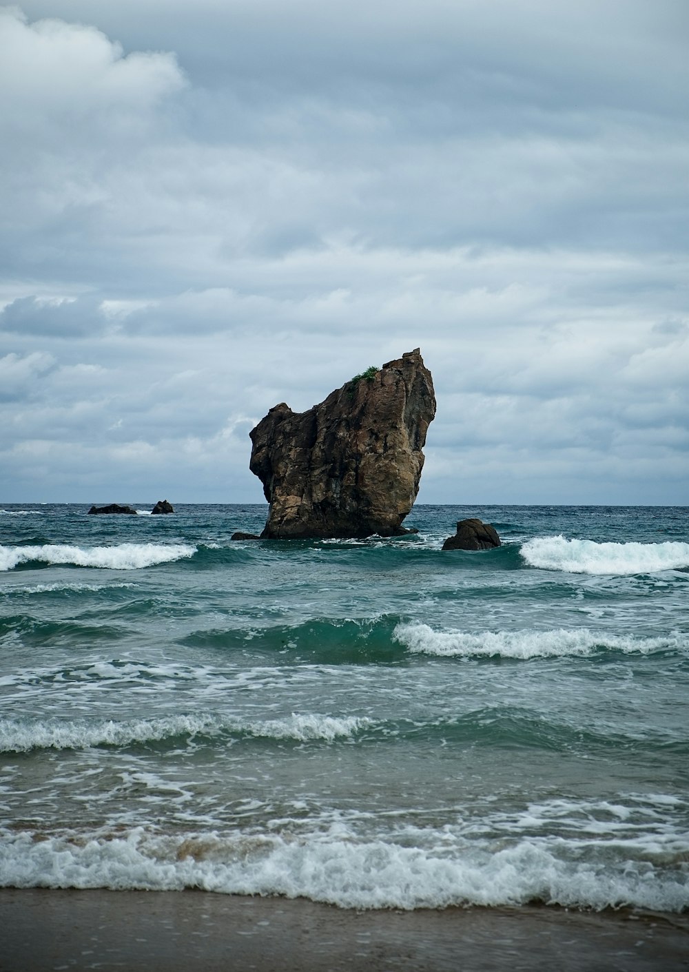 rock formation on body of water