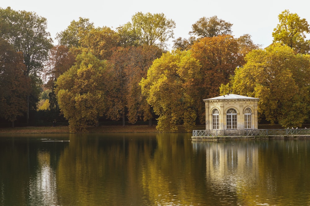 white gazebo on far bank of lake