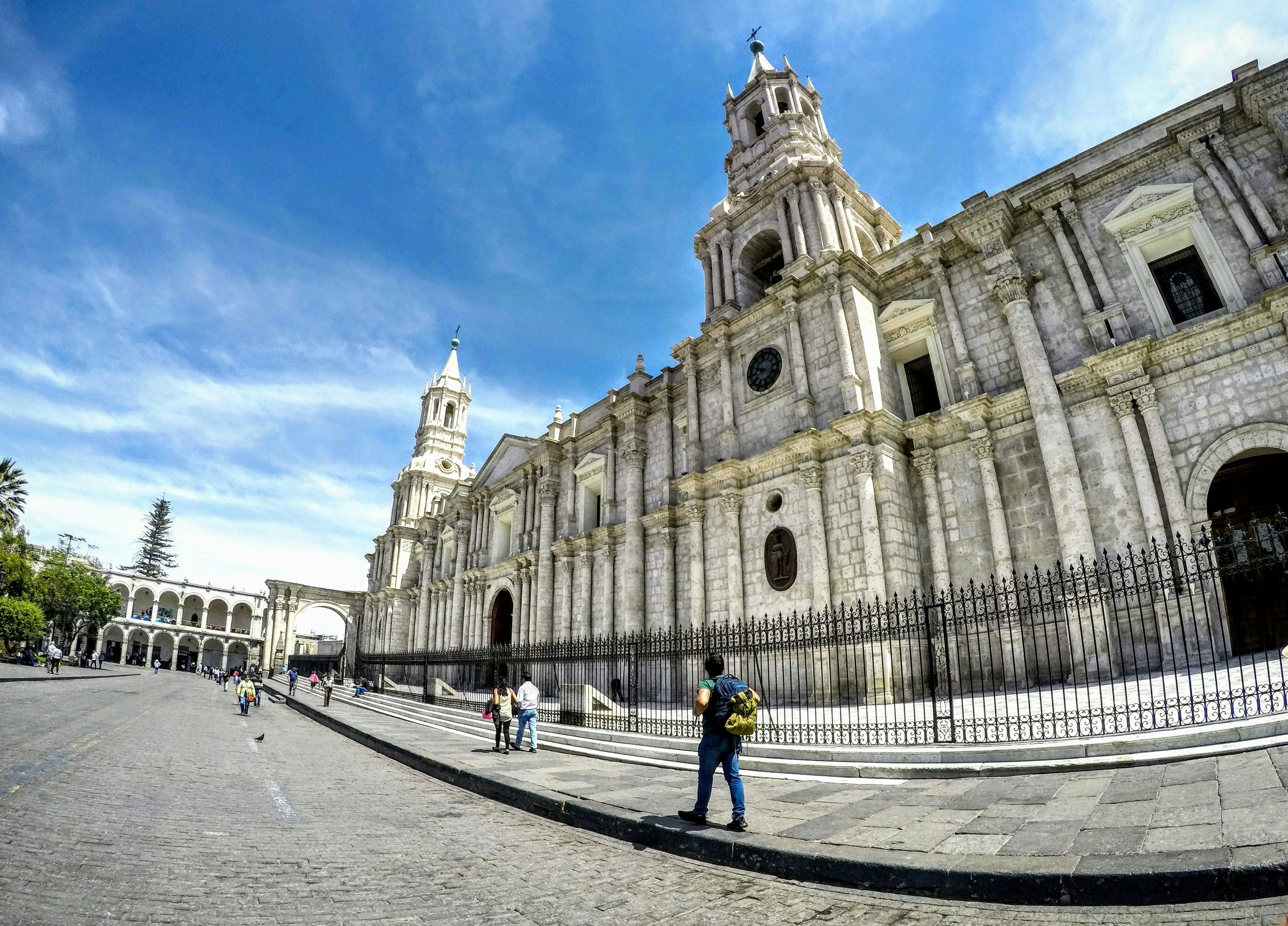 man walking beside church