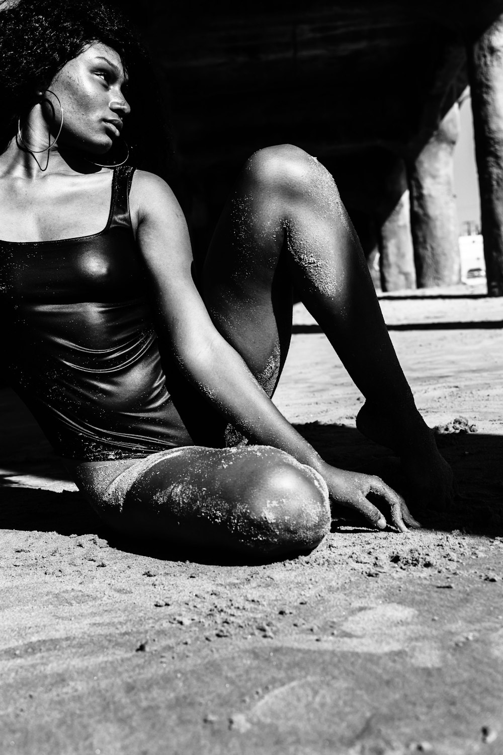 woman in swimsuit under dock