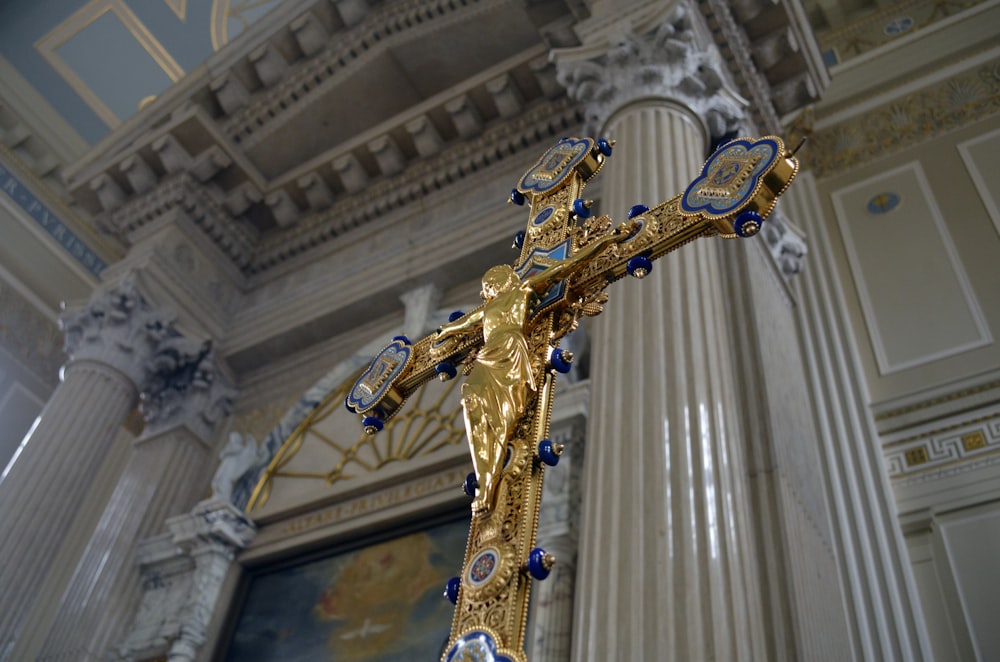 gold-colored crucifix