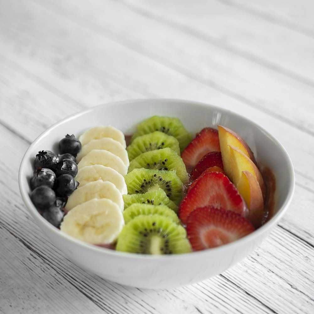 bowl of sliced fruits