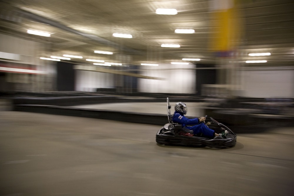 man riding on go-kart