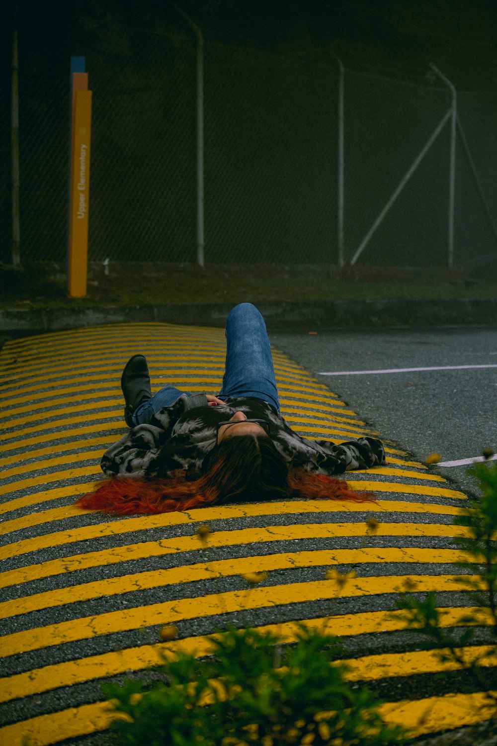 person lying on pedestrian crossing