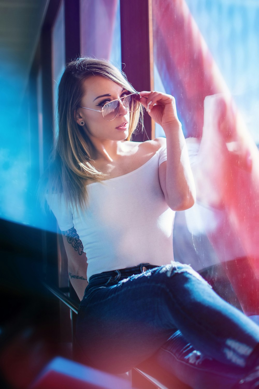 woman wearing sunglasses in the window