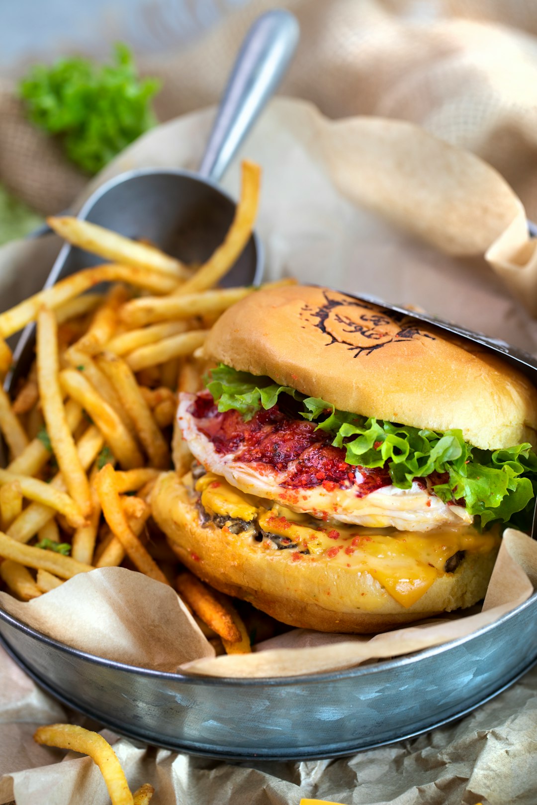hamburger and fries on gray plate