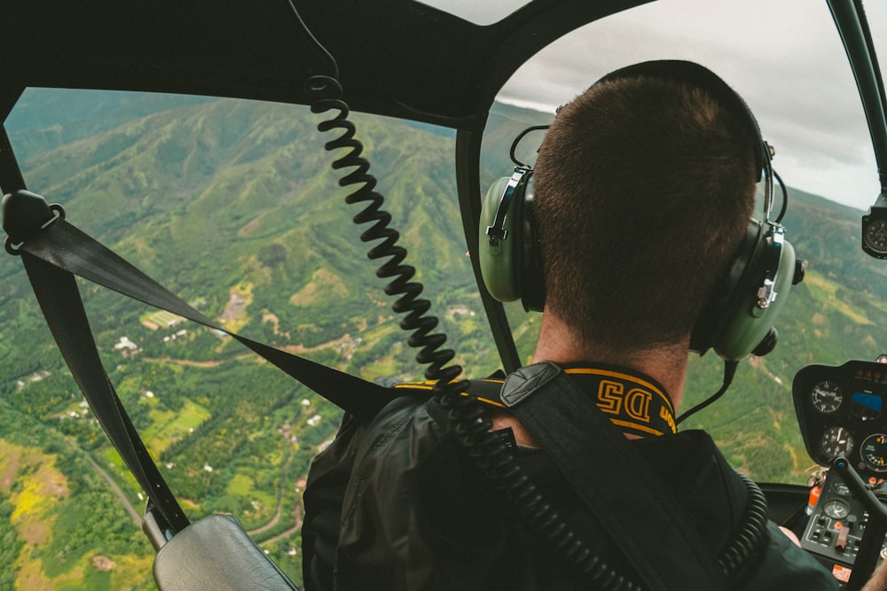 man riding helicopter