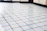 Close-up photo of glossy ceramic tiles arranged in a stylish pattern.