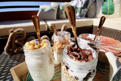Close-up of creamy yogurt jars with traditional Kurdish patterns.