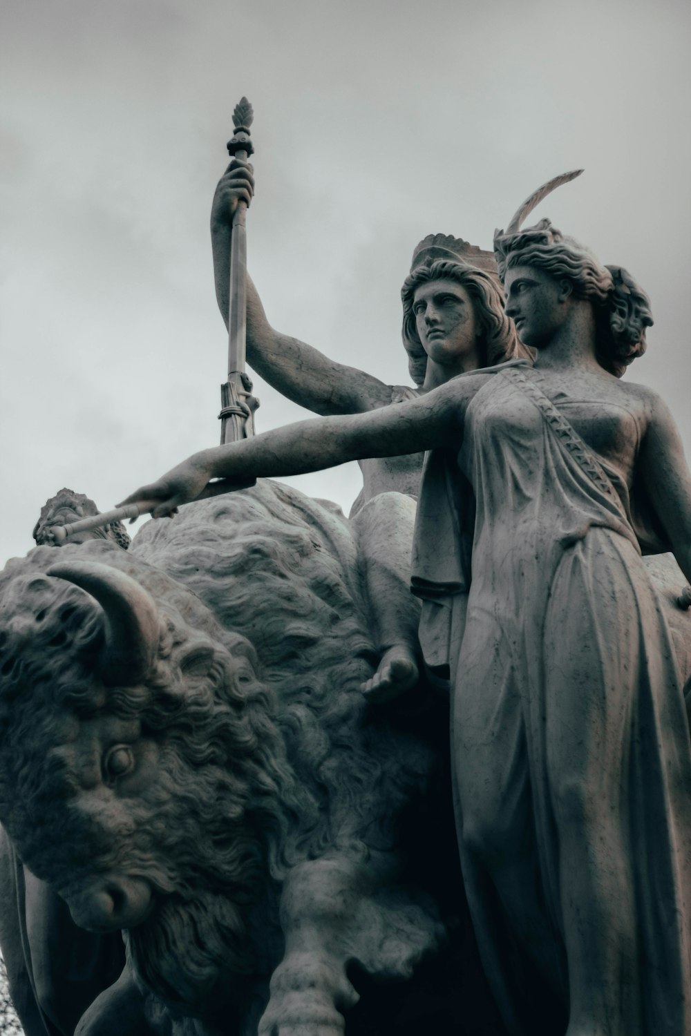 man holding sword statue