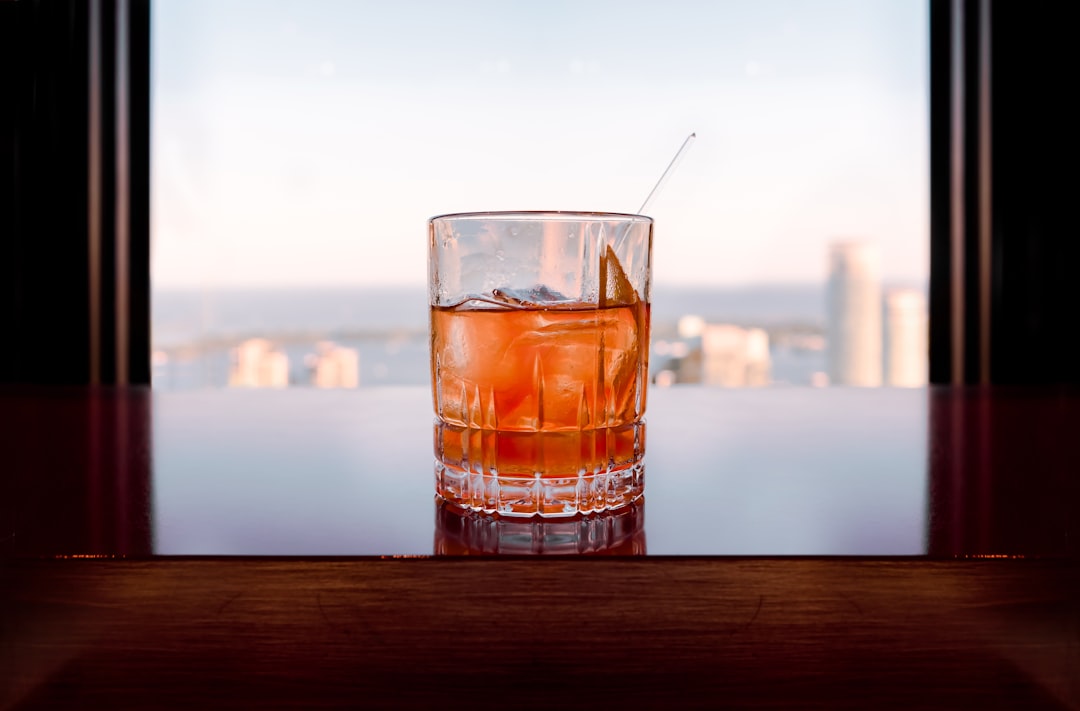 glass of liquor on table,