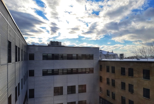 Image of a commercial flat roof on a Davis retail building with workers finishing the final touches.