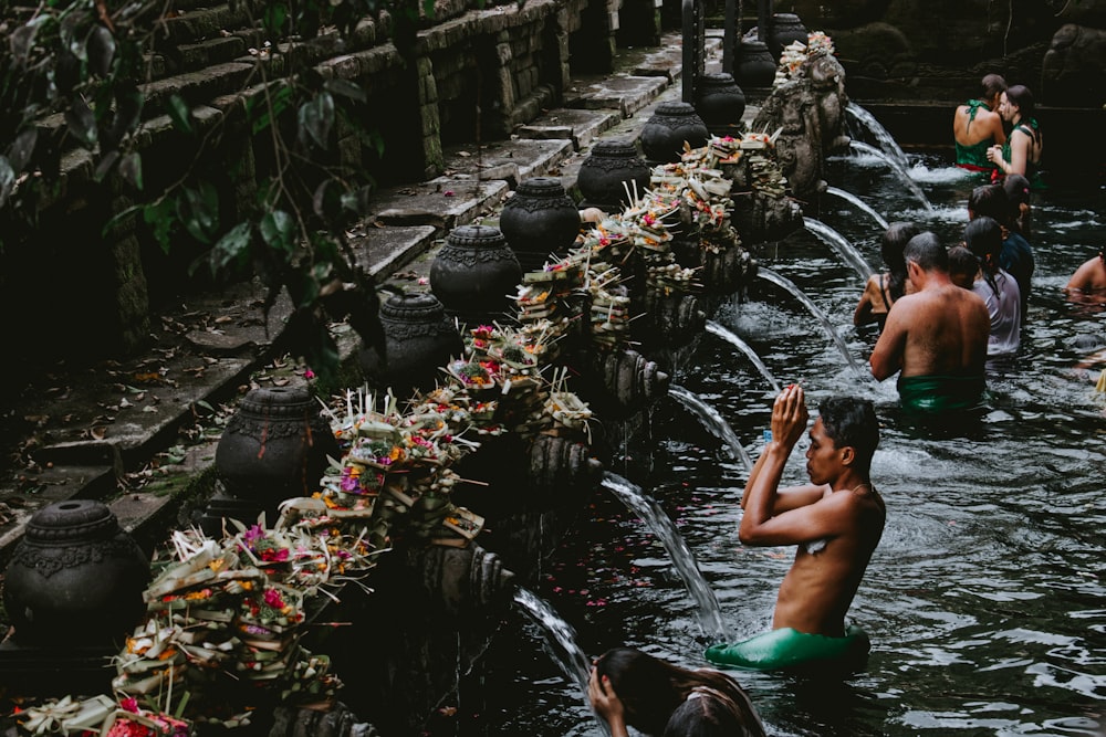 boy showering on lake