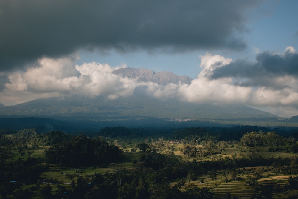 a view of a mountain range with clouds in the sky