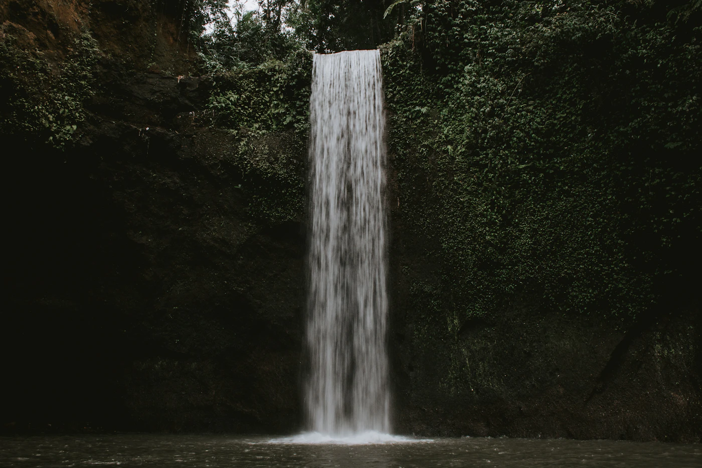 Long-exposure photo of a jungle waterfall near Munduk