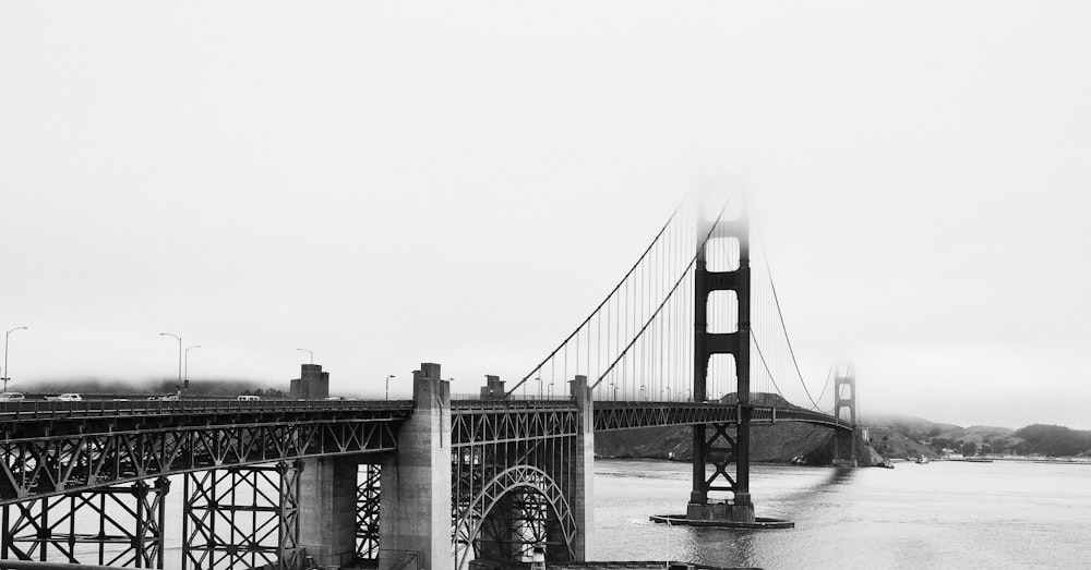 grayscale photography of concrete bridge