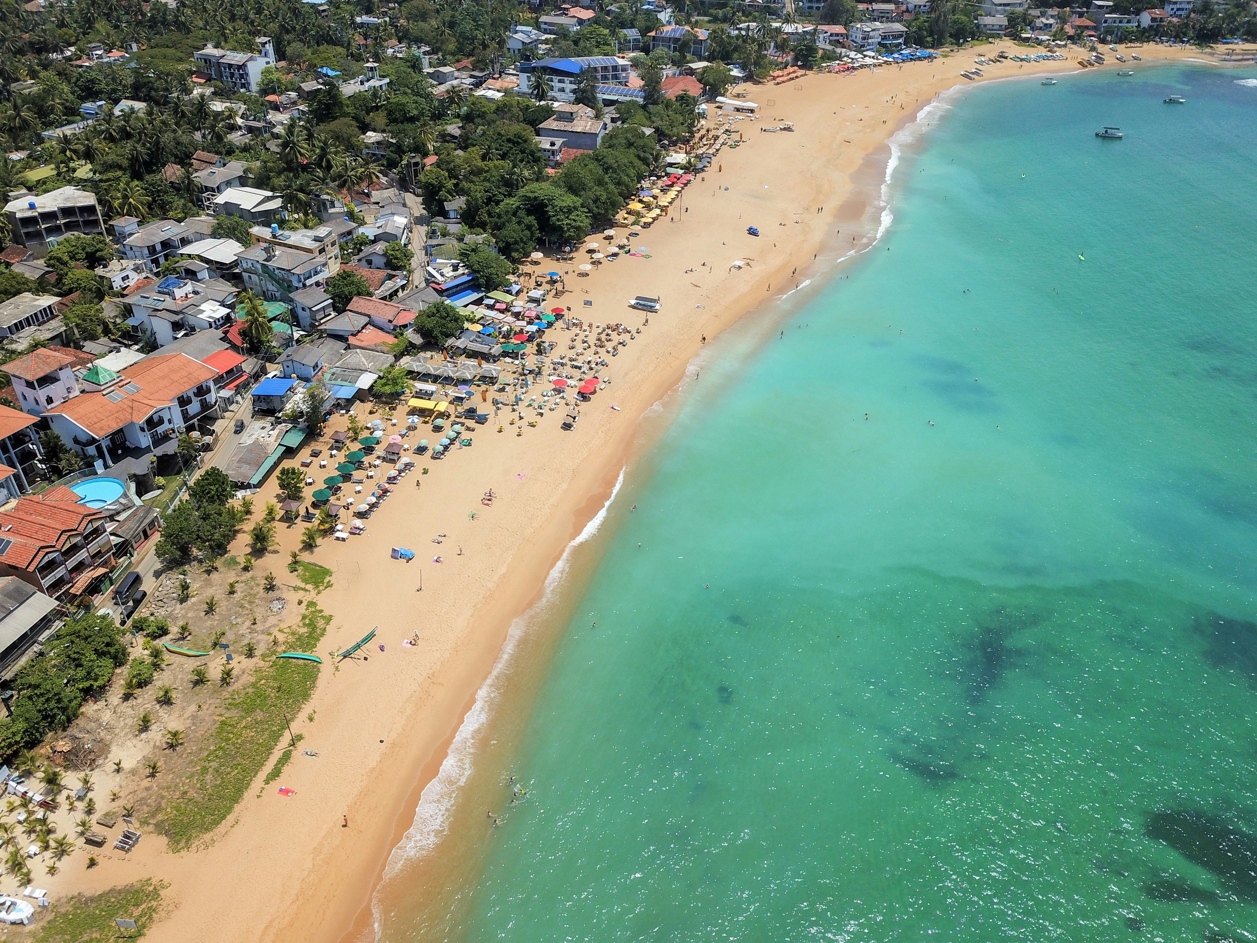 aerial view of people near sea