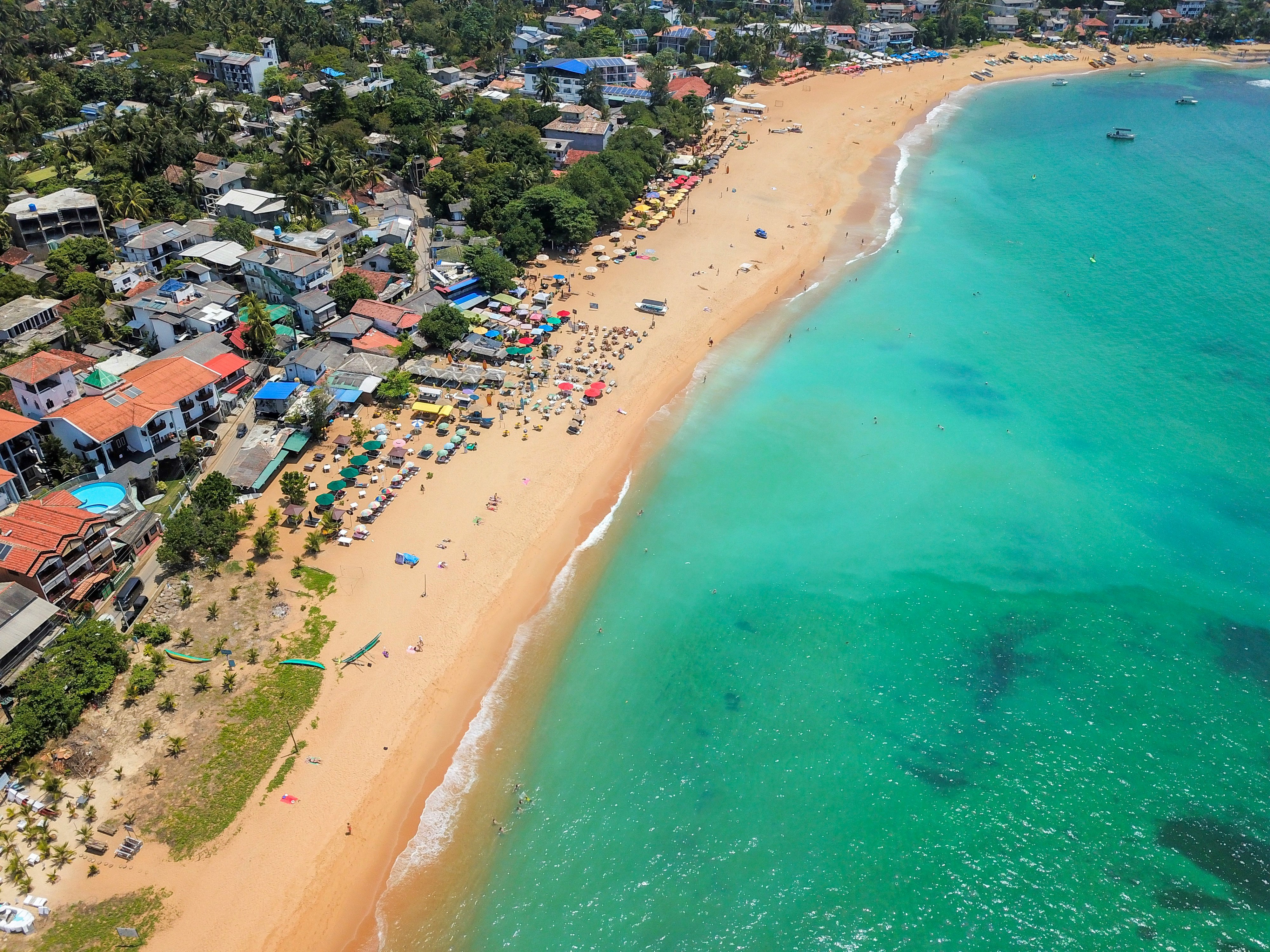 aerial view of people near sea