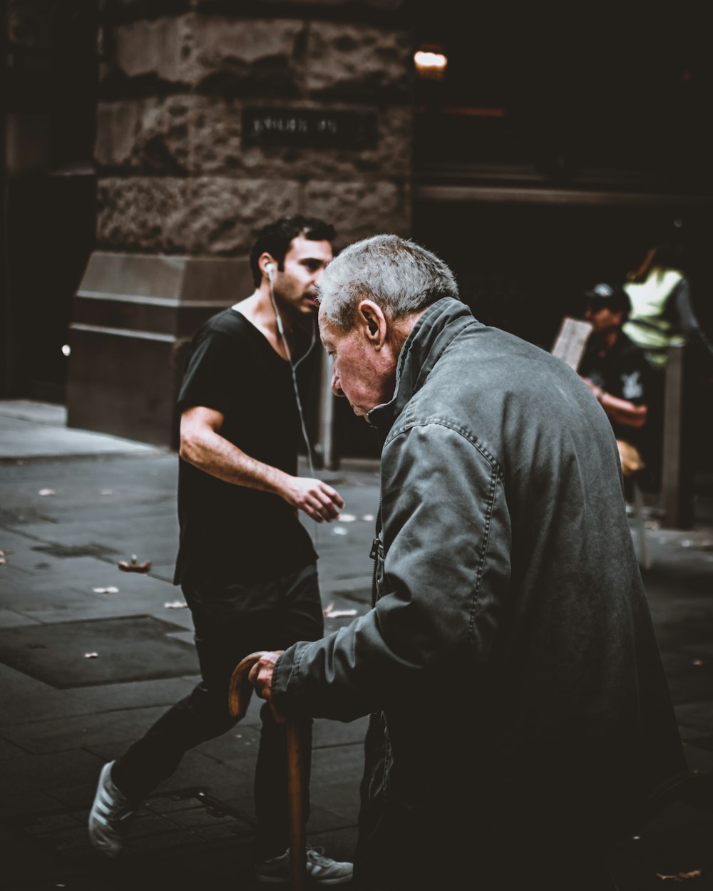 man holding walking cane