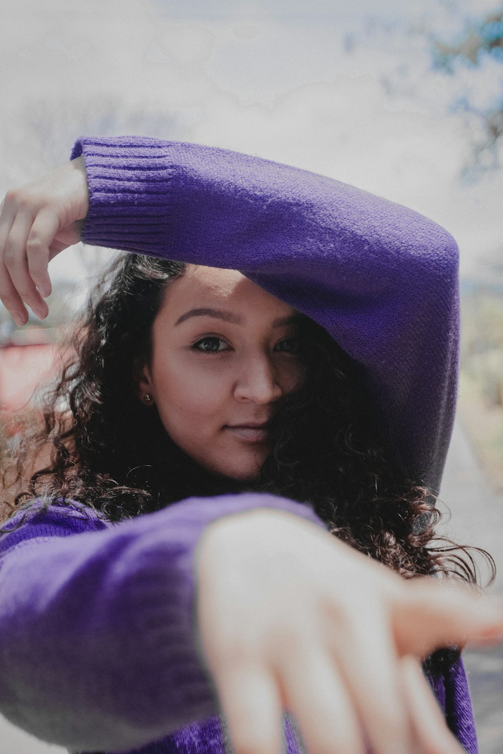 man wearing purple sweater