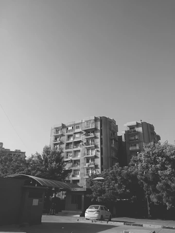 Photo of a well-maintained residential building in a vibrant Pittsburgh neighborhood under clear skies.
