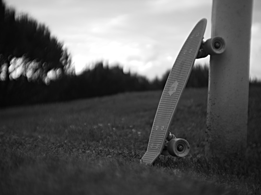 Penny board leaning on post