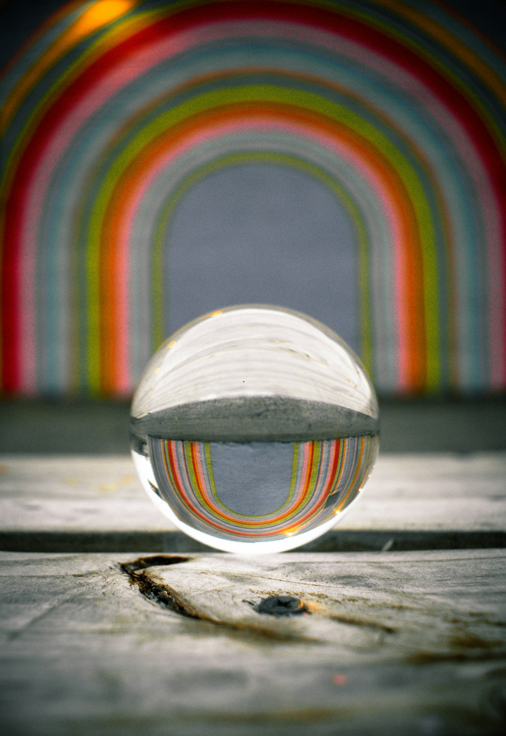 clear glass ball on gray surface