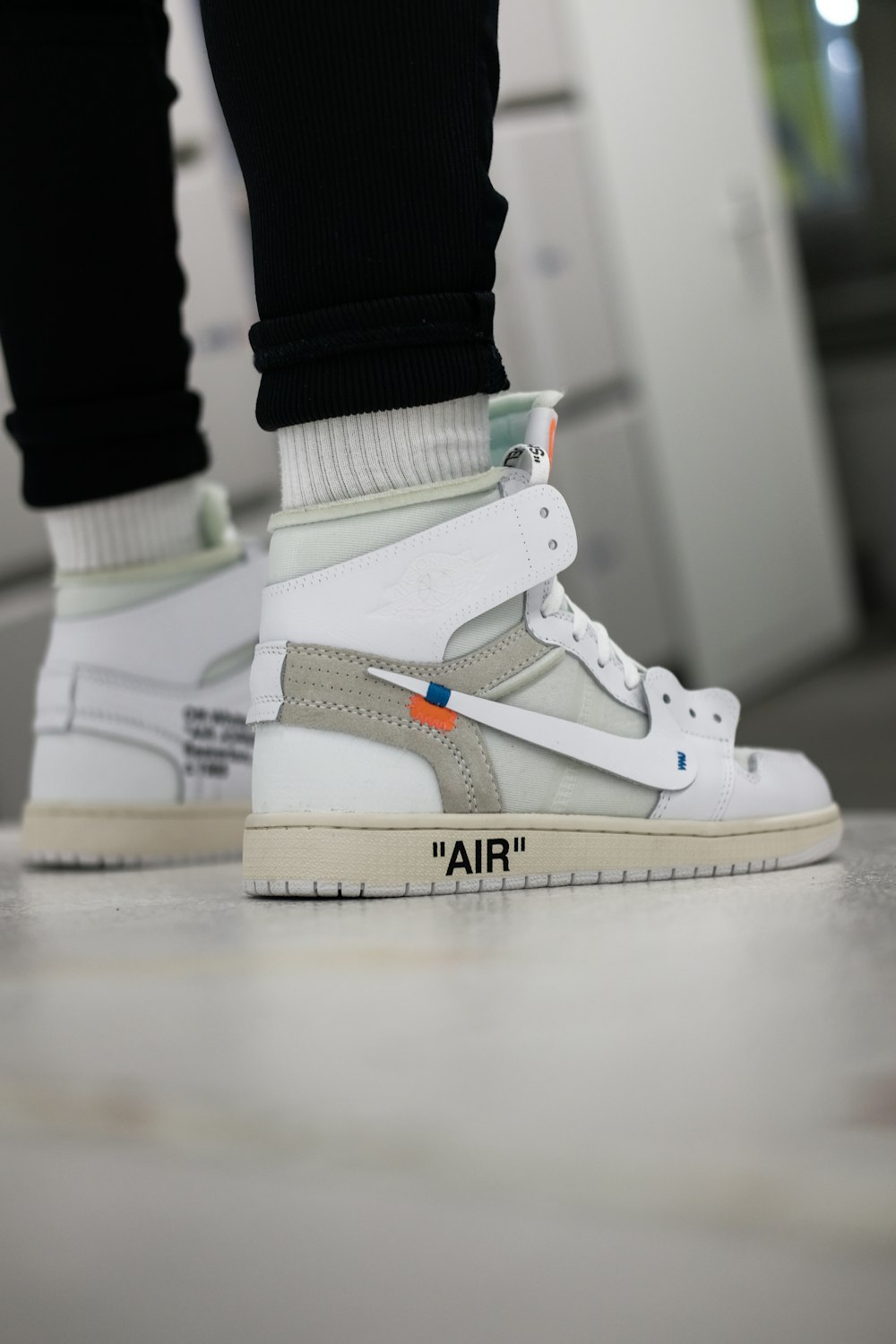 person wearing Nike x Off-white shoe