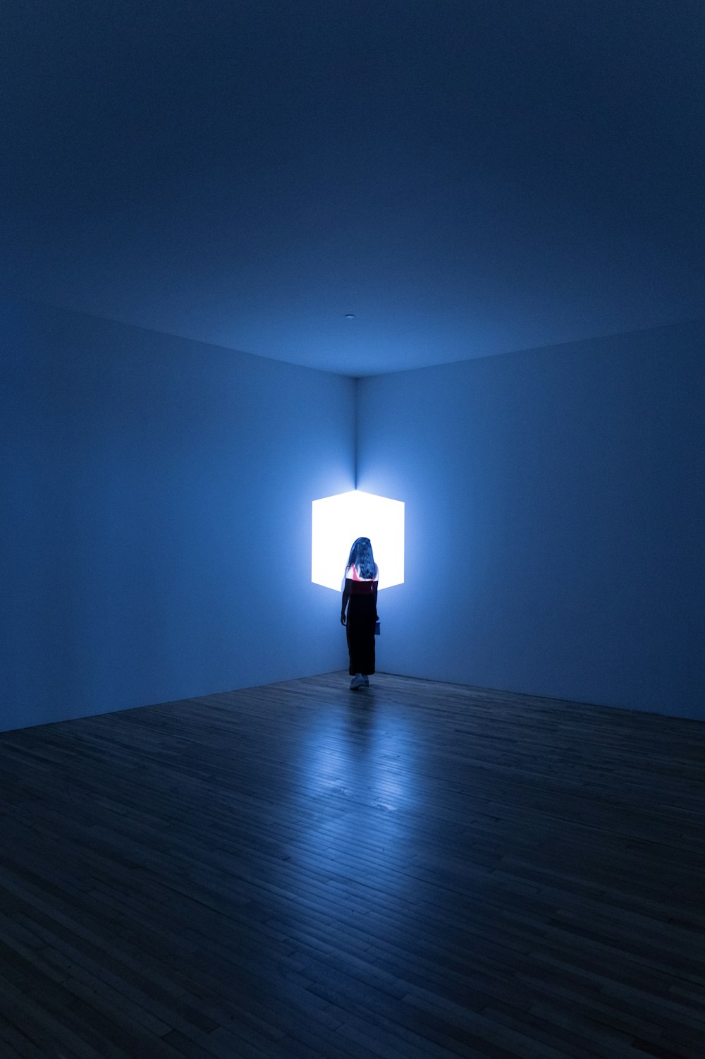 woman standing in the corner of the room