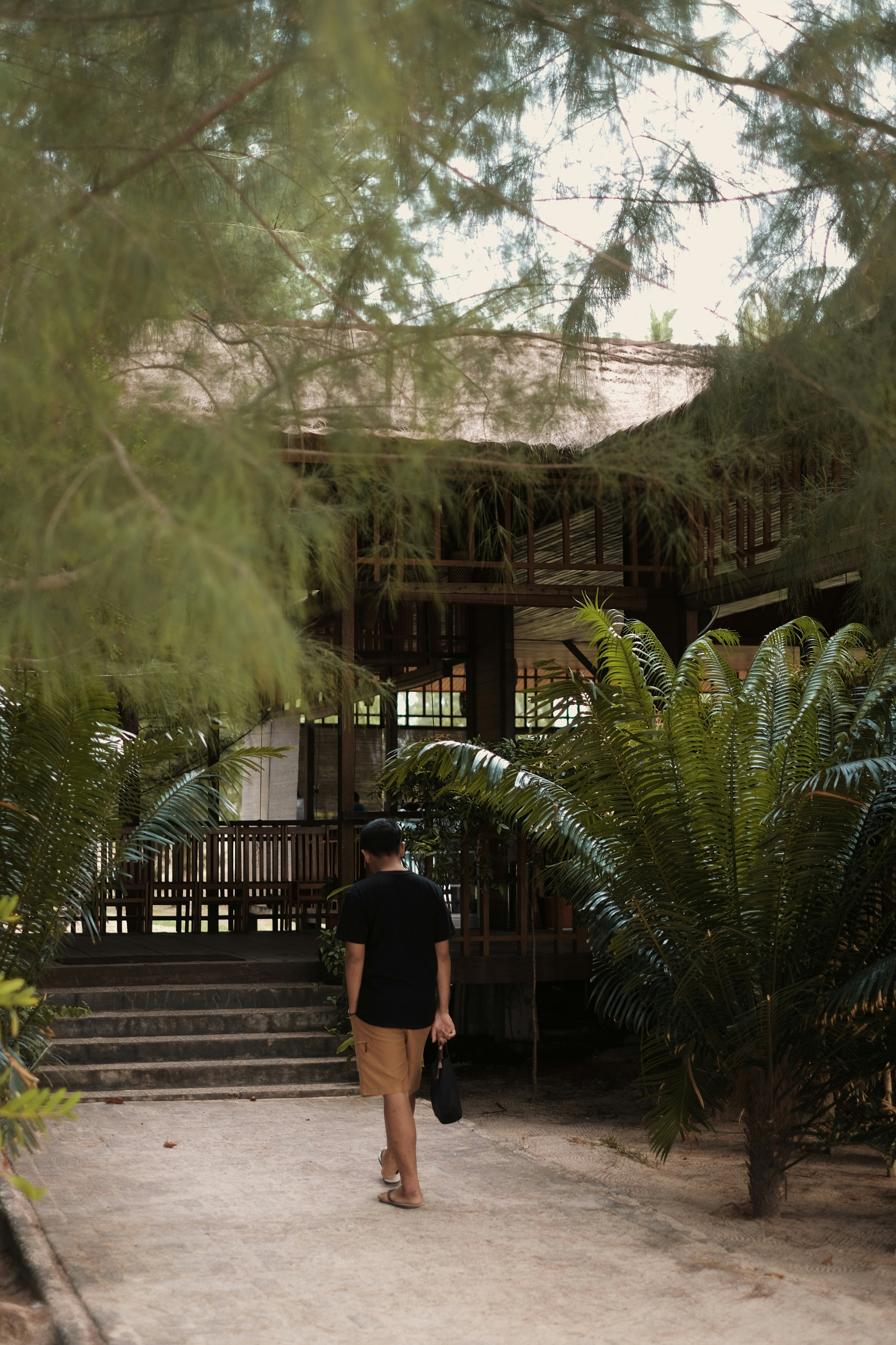 A traveler exploring a quiet architectural courtyard