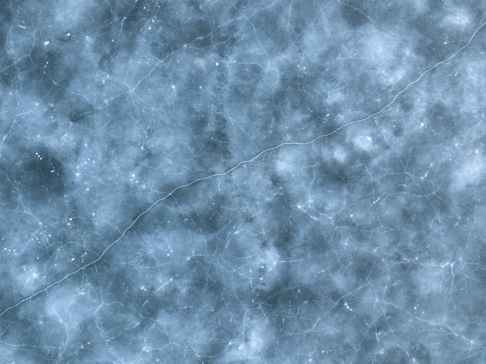 uno sfondo strutturato blu e bianco con piccole stelle