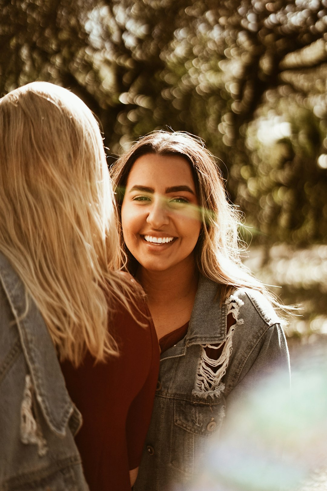 smiling woman wearing denim jacket